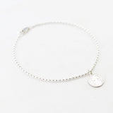 Armband bolletjes bedel