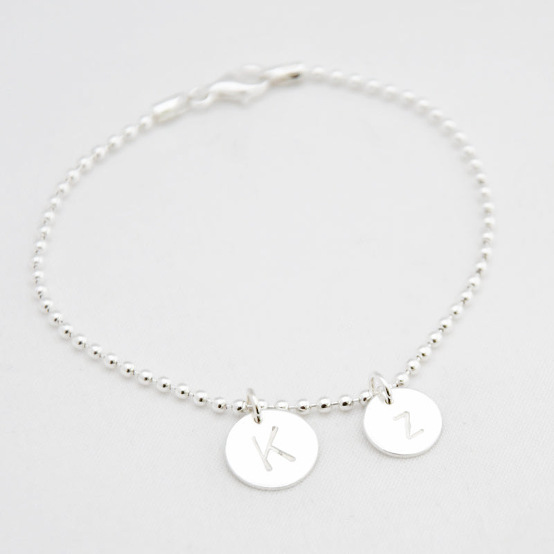 armband letter bedel twee rondels